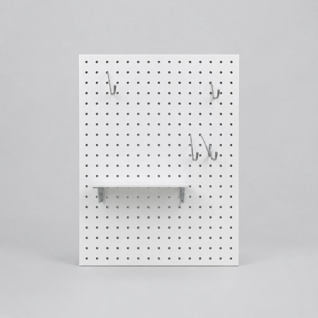 White perforated pegboard wall panel with hooks